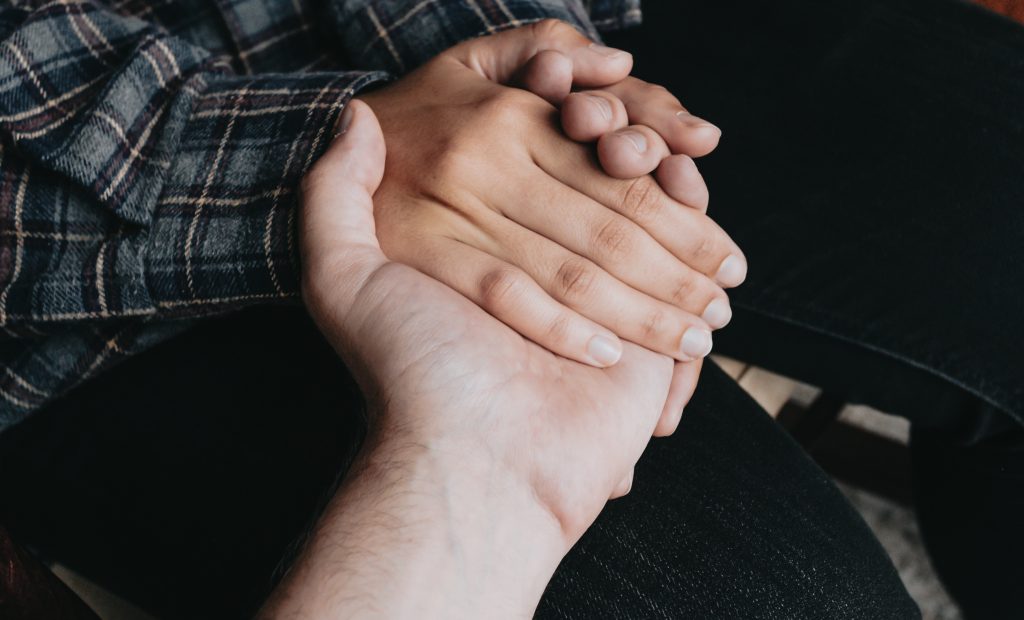 People holding hands, self help and depression concept, minimal copy space